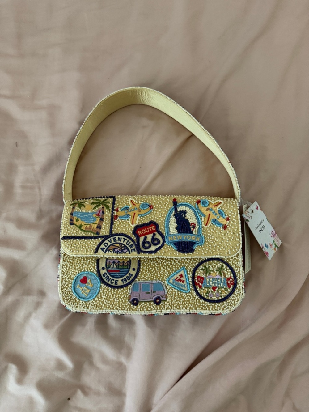 India Boutique Cream Beaded Shoulder Bag with Multicolor Travel Patches